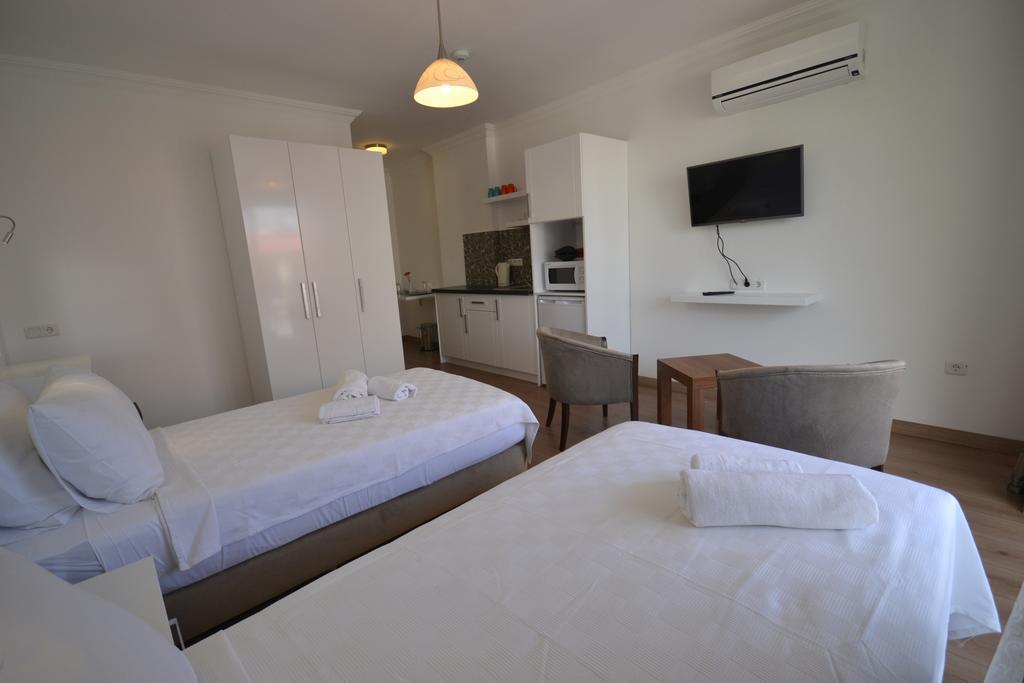 Kelebek Studio Apartments Калкан Стая снимка