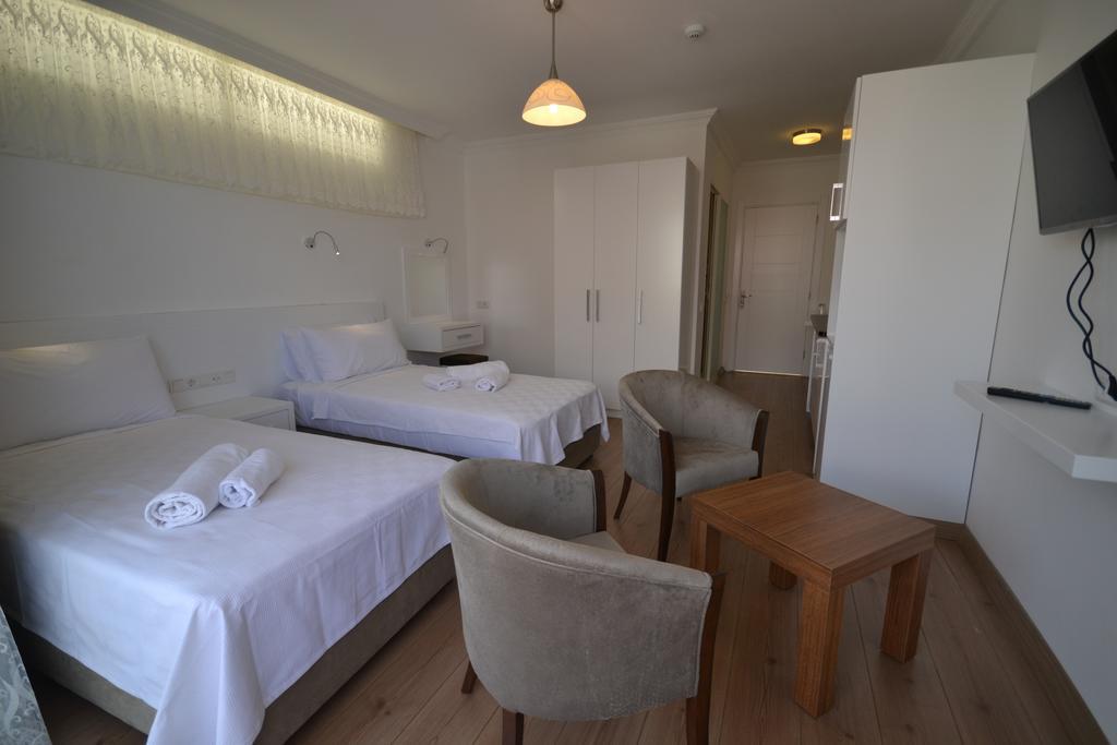 Kelebek Studio Apartments Калкан Стая снимка